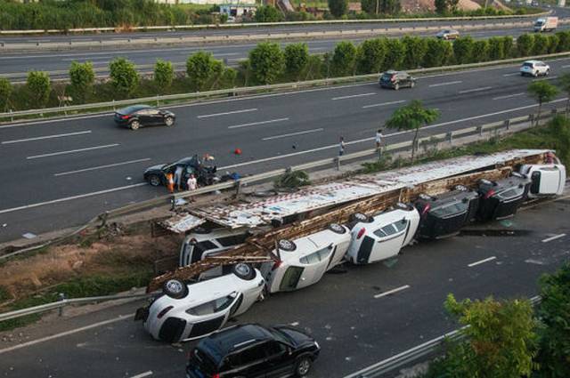 Trailer Carrying Luxury Cars Rolls Over in China Damaging All