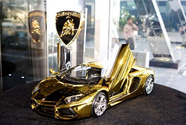 gold car aventador