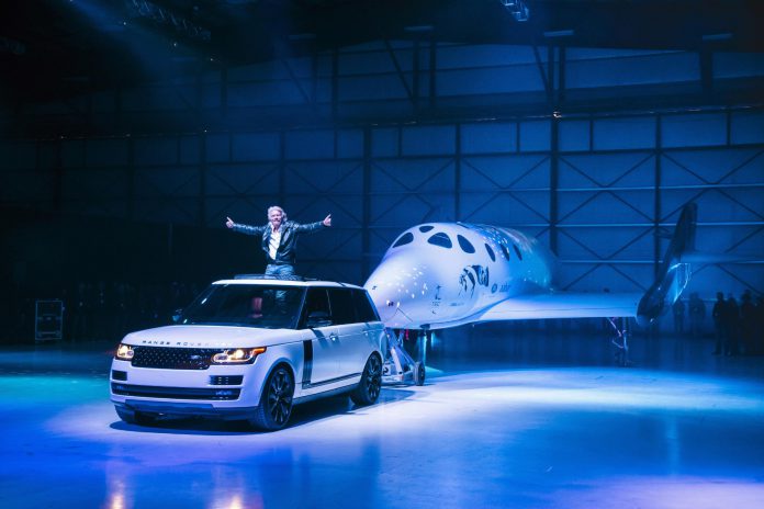 Virgin Group founder Richard Branson unveiling the new VSS Unity, towed by a Range Rover Autobiography