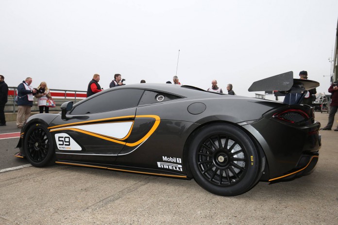 McLaren 570S GT4 showing off its rear wing mounted on aluminum pylons